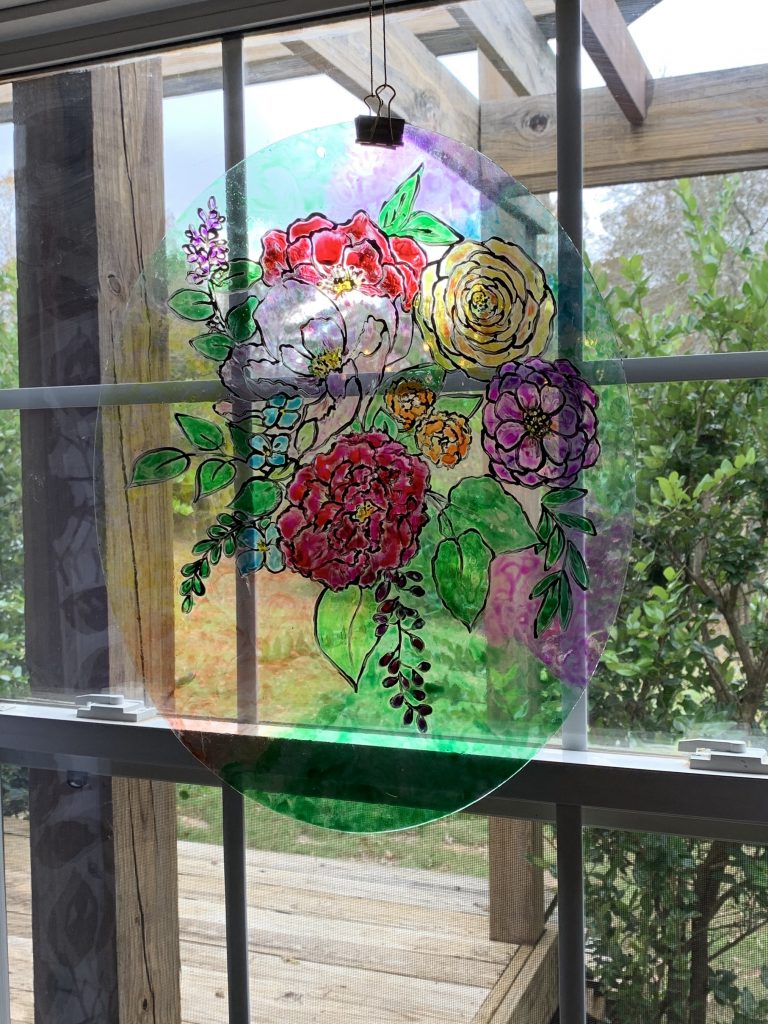 painted stained glass flowers in a window