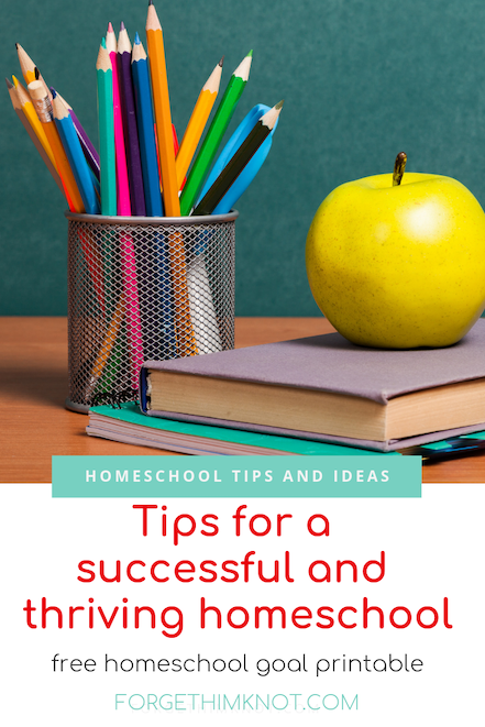 stacked books, an apple and colored pencils for a homeschool lesson