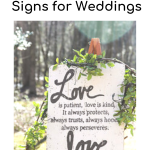 White rustic Bible verse sign with "Love is patient love is kind...love never fails"