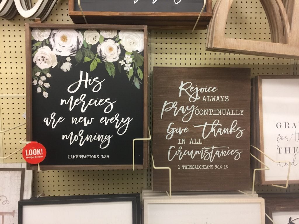 Two Bible verse signs from Hobby Lobby one with flowers the other rustic brown wood
