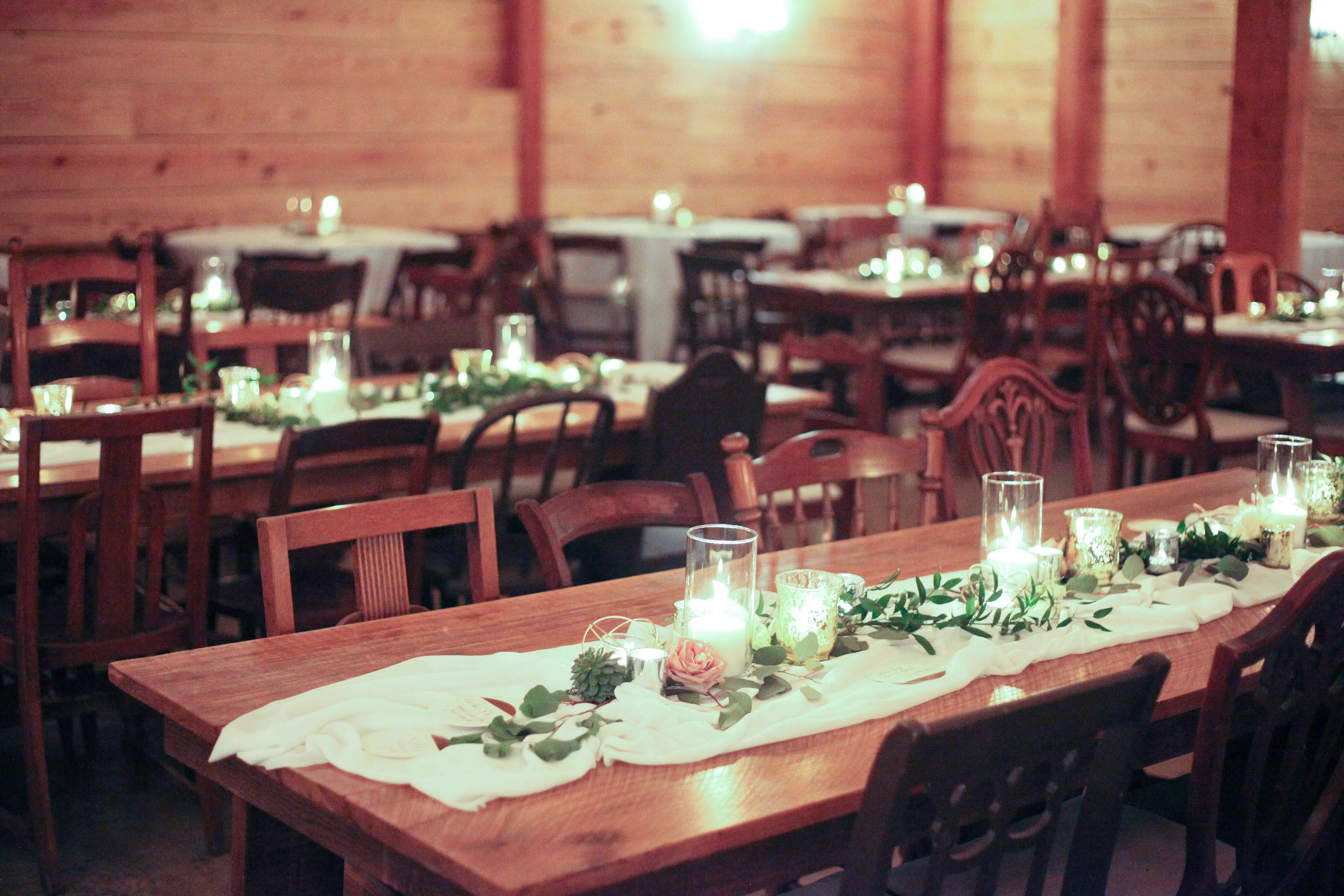Reception tables in rustic barn