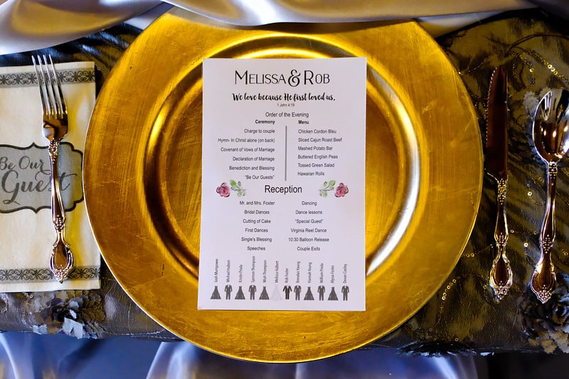 Gold charger with Bible verse wedding program