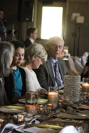 Christ centered wedding sitting at table