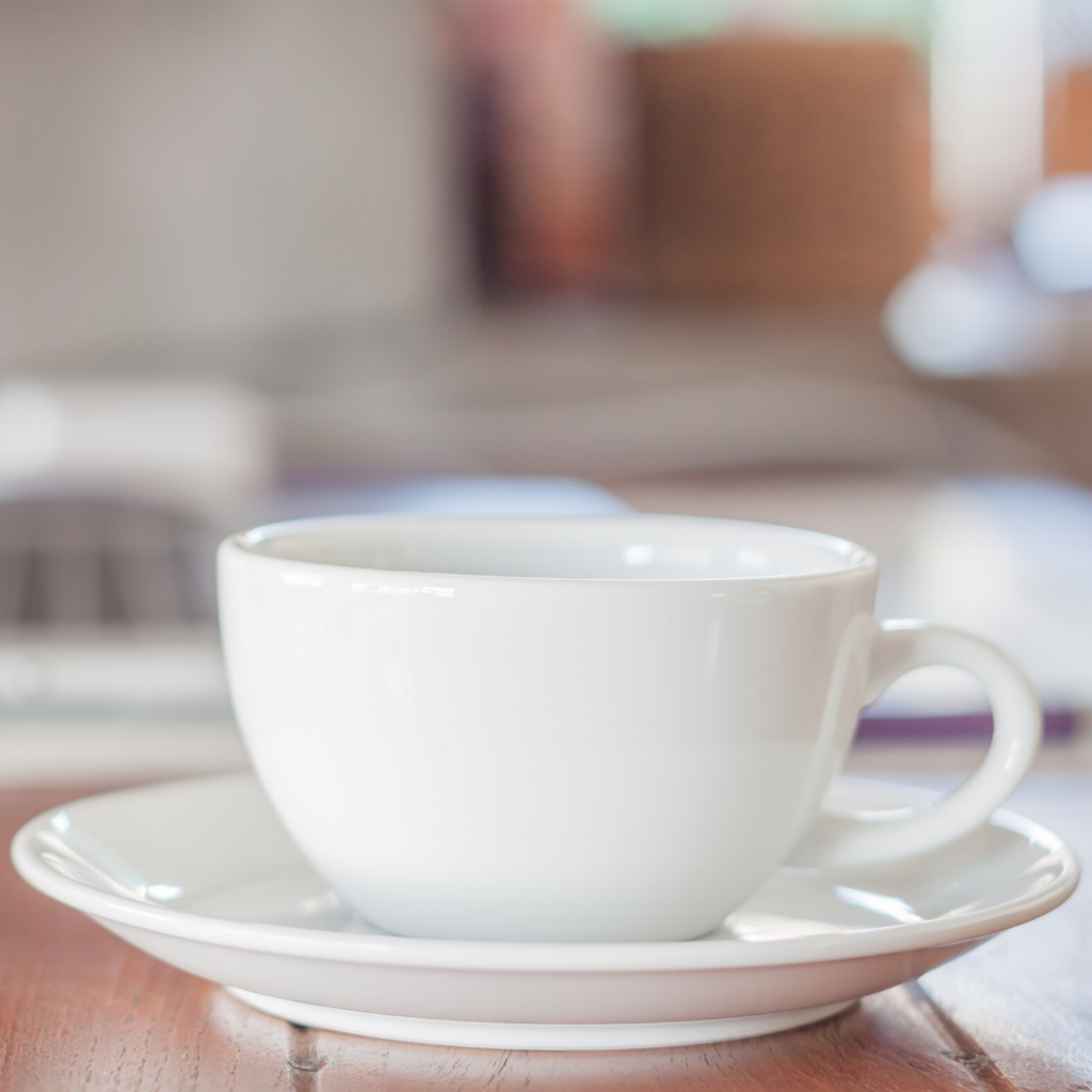 white coffee cup in dish