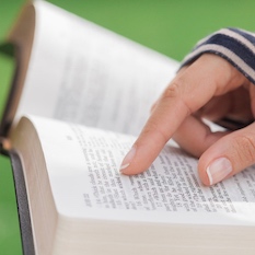 child reading the Bible 